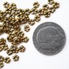 Mellandel mellan blomma, 5 mm, Antik guld, 25 st - Bild 2